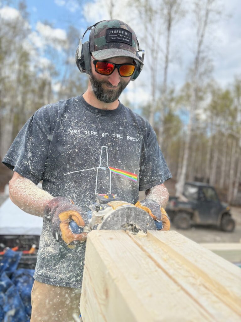 Man sawing wood