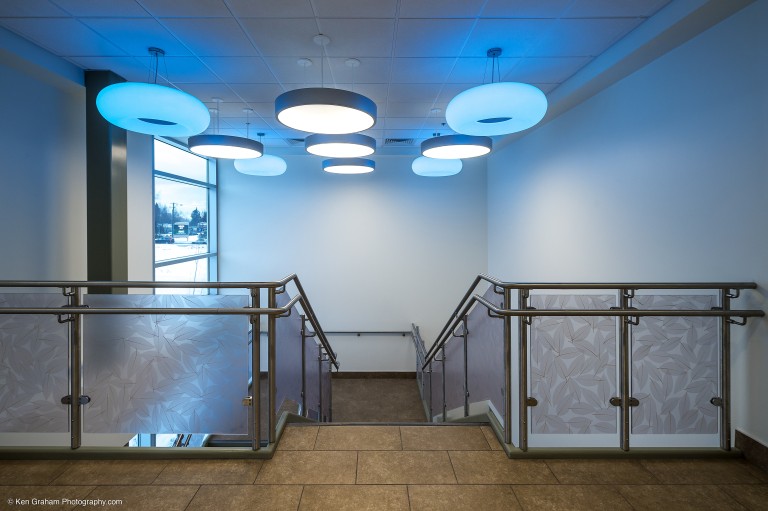 Stairwell with blue and white decorative chandeliers