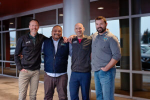 Multiple AMC employees smiling together