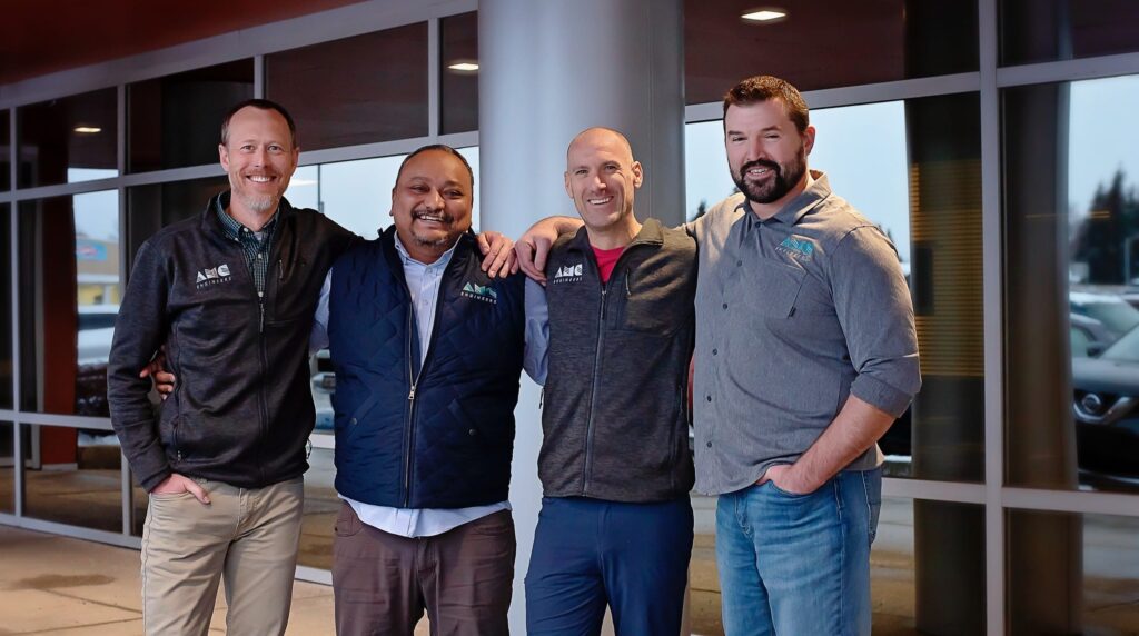 Multiple AMC employees smiling together