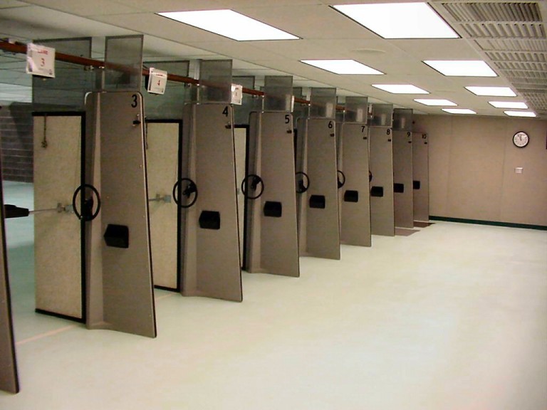 Brightly lit stalls in shooting range